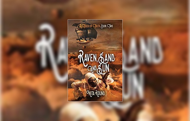 Raven, sand and sun by Nita Round