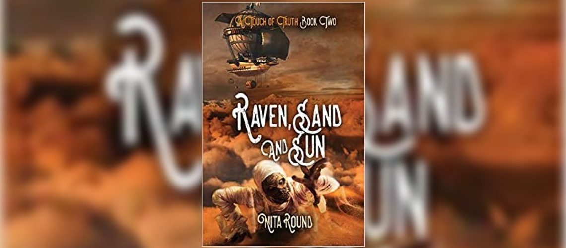 Raven, sand and sun by Nita Round